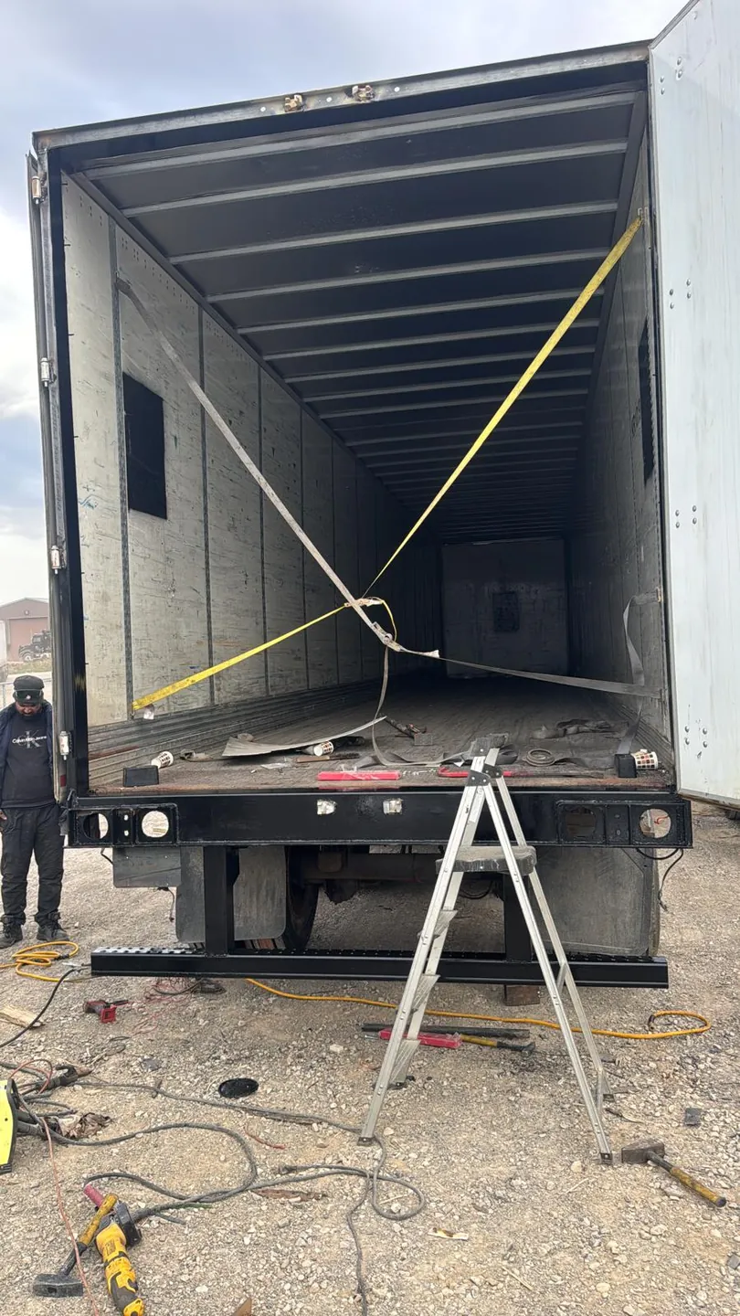 Baaz Welding crew repairing a dry van trailer body on-site in a yard